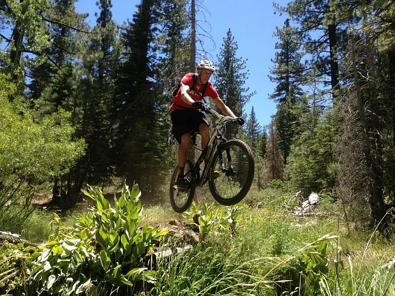 Jamie riding mountain bike this summer after completing both Doxorubicin treatments